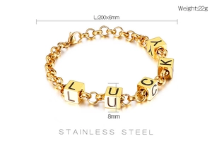 Detailed view of Lucky letter cubes on a gold stainless steel chain bracelet with measurements