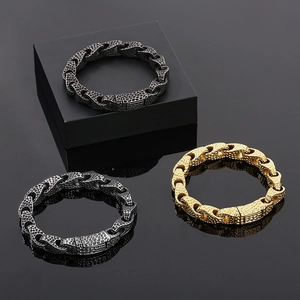 Macro detail of men's hammered titanium steel bracelets in gold, silver and black finish
