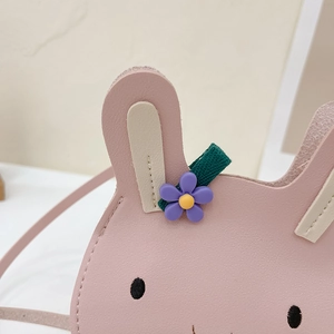 Close-up of pink PU leather rabbit coin purse featuring floral ear detail and embroidery