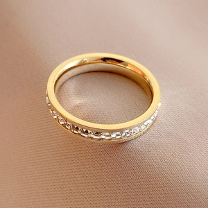 Elegant gold titanium eternity ring featuring channel-set square zircons on satin silk