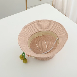 Kids woven straw sun hat with cherry charms featuring inner sweatband and chin strap