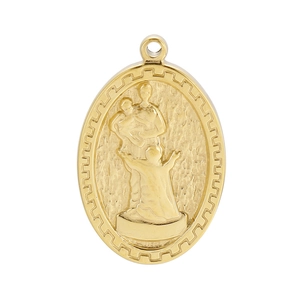 Macro view of gold stainless steel oval pendant with religious figures and textured details
