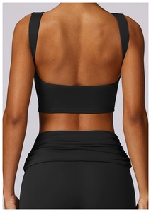 Close-up of shockproof high-waist black yoga set with breathable racerback sports bra