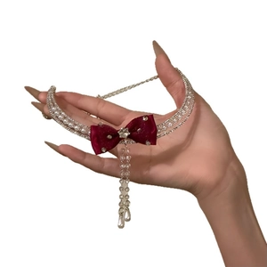 Elegant wine red satin bow necklace with double-row pearls and sparkling rhinestone tassels