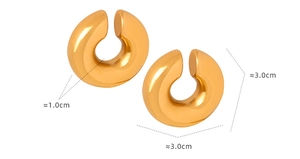 Detailed view of chunky 30mm gold-plated titanium steel hoop earrings with glossy finish