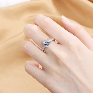 Classic six-prong two-carat silver ring with sparkling round centerpiece on model hand