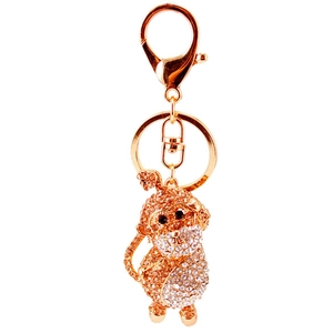 Golden crystal monkey keychain with sparkling rhinestones on a white background