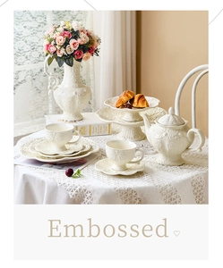 European vintage style embossed ceramic afternoon tea set on a lace tablecloth