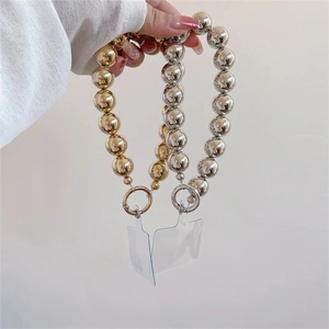 Close-up of metallic gold and silver beaded phone straps with clear card attachments