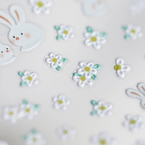 Stereoscopic 5D nail art stickers featuring cute white rabbits and flowers with embossed texture
