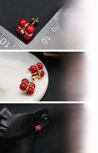 Detailed views of red natural freshwater pearl stud earrings with 18K gold plated setting