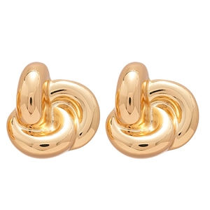 Polished gold knot earrings featuring a minimalist twisted design on a white background