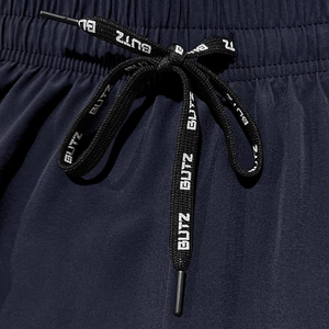 Macro detail of high-density navy athletic fabric with BUTZ printed drawstring cords