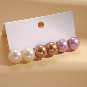 Set of six pairs of geometric faux pearl stud earrings in white, coffee, and lilac colors