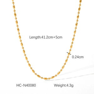 Detail of beaded gold stainless steel necklace with 41.2cm length and 5cm extension