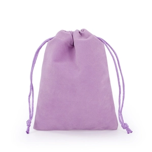 Detailed view of a purple velvet drawstring pouch showing soft fabric texture and cord
