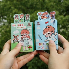 Close-up of creative metal paper clips in green and blue cartoon illustrated packaging