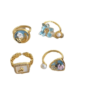 Vintage Baroque pearl rings set with blue floral enamel and crystal accents in gold finish