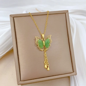 Golden titanium steel necklace featuring a green butterfly pendant with crystal tassels