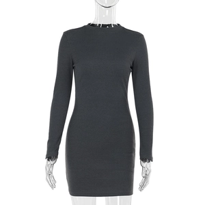 Detail of dark grey ribbed knit fabric on a slim fit long sleeve bodycon dress