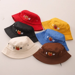 Close-up of kids bucket hats showing detailed bear embroidery and six vibrant colors
