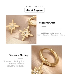 Close-up of gold starburst hoop earrings with sparkling zircon and mirror polished finish