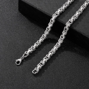 Detailed close-up of a silver stainless steel square-weave byzantine chain for men