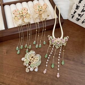 Detail of Chinese style hair pin set with pink flowers, green jade and pearl tassels