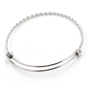 Detailed macro view of silver adjustable twisted rope steel bangle bracelet
