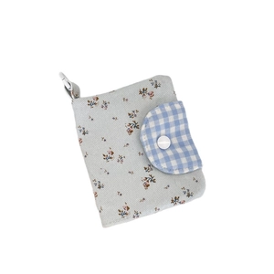 Floral fabric coin purse with blue patterns, metal carabiner, and snap button closure