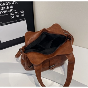 Top view of the spacious interior of this brown leather tote bag with functional pockets