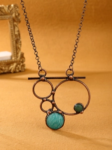 Detailed close-up of a bronze retro necklace with labradorite and amazonite gemstones
