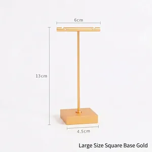 Detail of matte gold T-bar earring stand with dimensions 13cm height and 6cm width