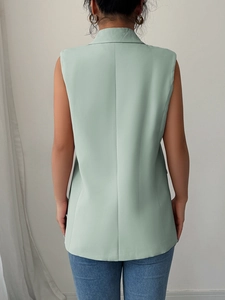 Back view of a slim fit sleeveless mint green waistcoat for elegant office commuting