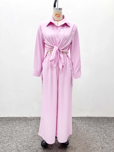 Detail of pink lavender two-piece set with knotted cropped shirt and wide-leg pants