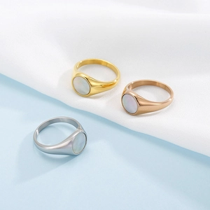 Minimalist geometric stainless steel rings with iridescent shell inlay in gold and silver