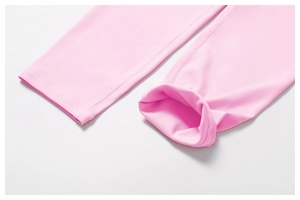 Close-up of pink yoga leggings featuring professional reinforced stitching and soft fabric