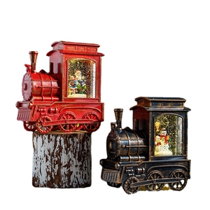 Christmas train snow globe lamp, vintage red and black locomotive holiday decoration.