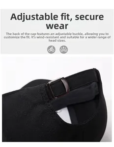 Detail of adjustable metal D-ring buckle on a black twill outdoor baseball cap