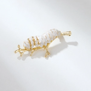 Elegant white caterpillar brooch on golden branch made of enamel and metal material