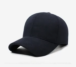 Close-up side view of thick wool fabric baseball cap showing warm texture and minimal stitching