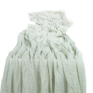 Light green boho cheesecloth table runner with soft crinkle texture for wedding decor