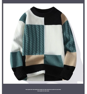 Close-up of color-block knit sweater featuring retro cable knit texture and crew neckline