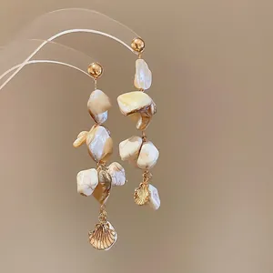 Elegant irregular shell tassel earrings with silver needle and golden scallop charms