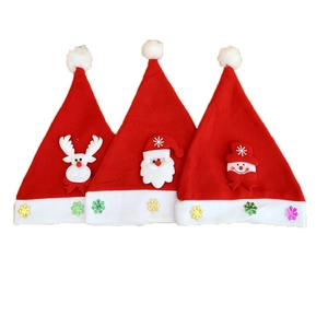 Three red Christmas hats with Santa, reindeer and snowman designs on white background