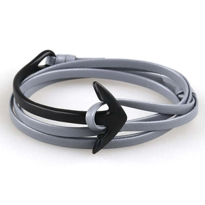 Detail of grey multi-layer leather wrap bracelet with black metal anchor clasp