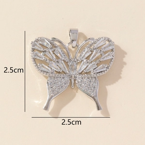 Detail view of silver butterfly pendant with cubic zirconia and 2.5cm size markings
