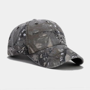 Detailed view of camouflage baseball cap with reinforced stitching and curved brim