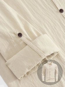 Close-up of linen shirt sleeve showing button details and textured beige fabric finish