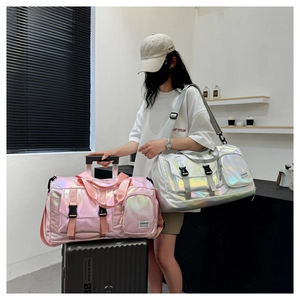 Detail of laser pink and silver duffel bags with large capacity and adjustable straps